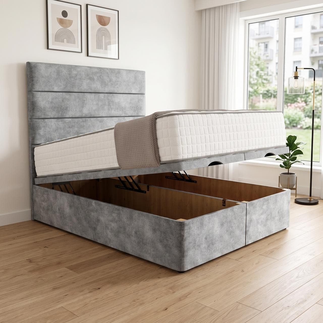 Monaco ottoman storage bed in mid grey with a headboard with three horizontal panel bands, base raised to show the full-length storage